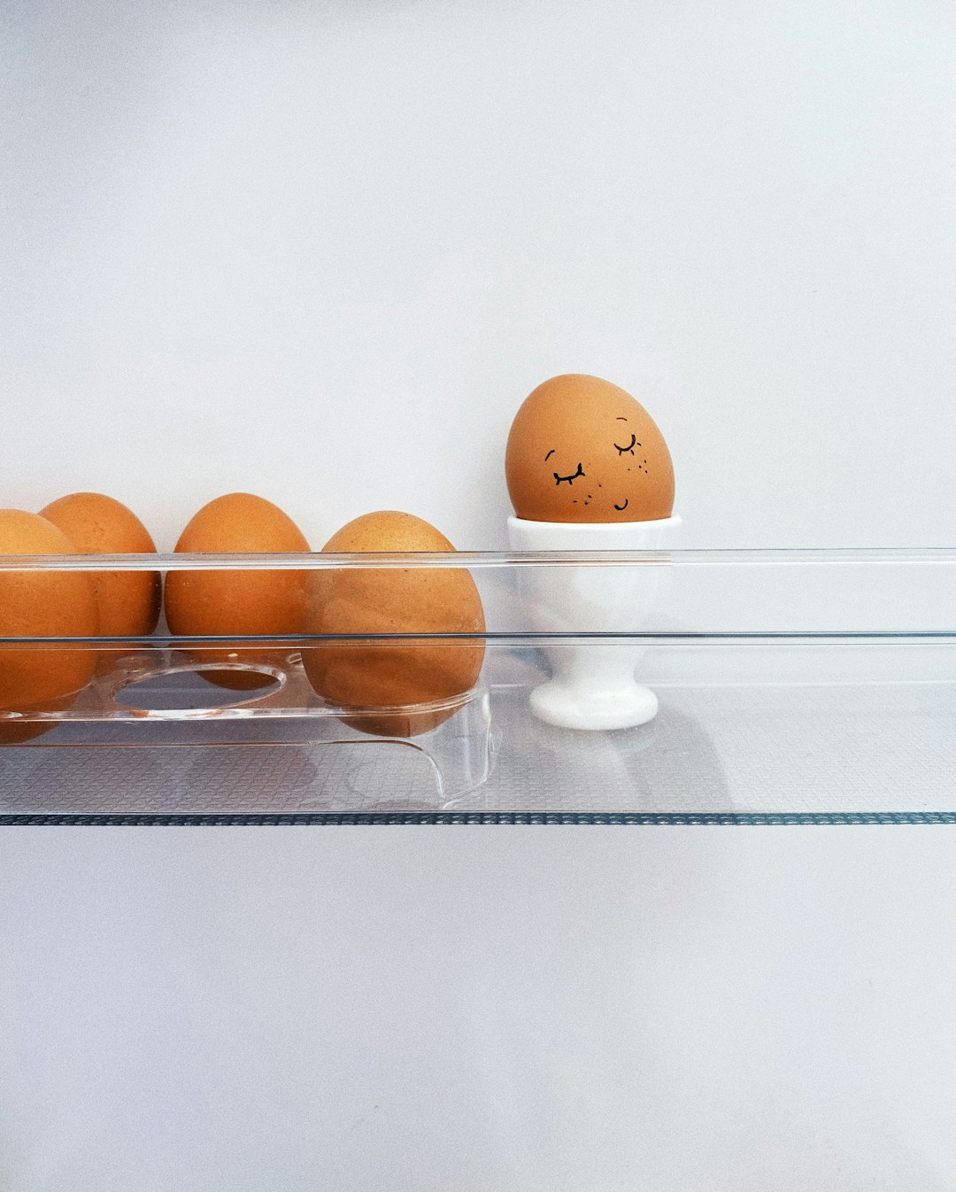 2 brown eggs on stainless steel tray