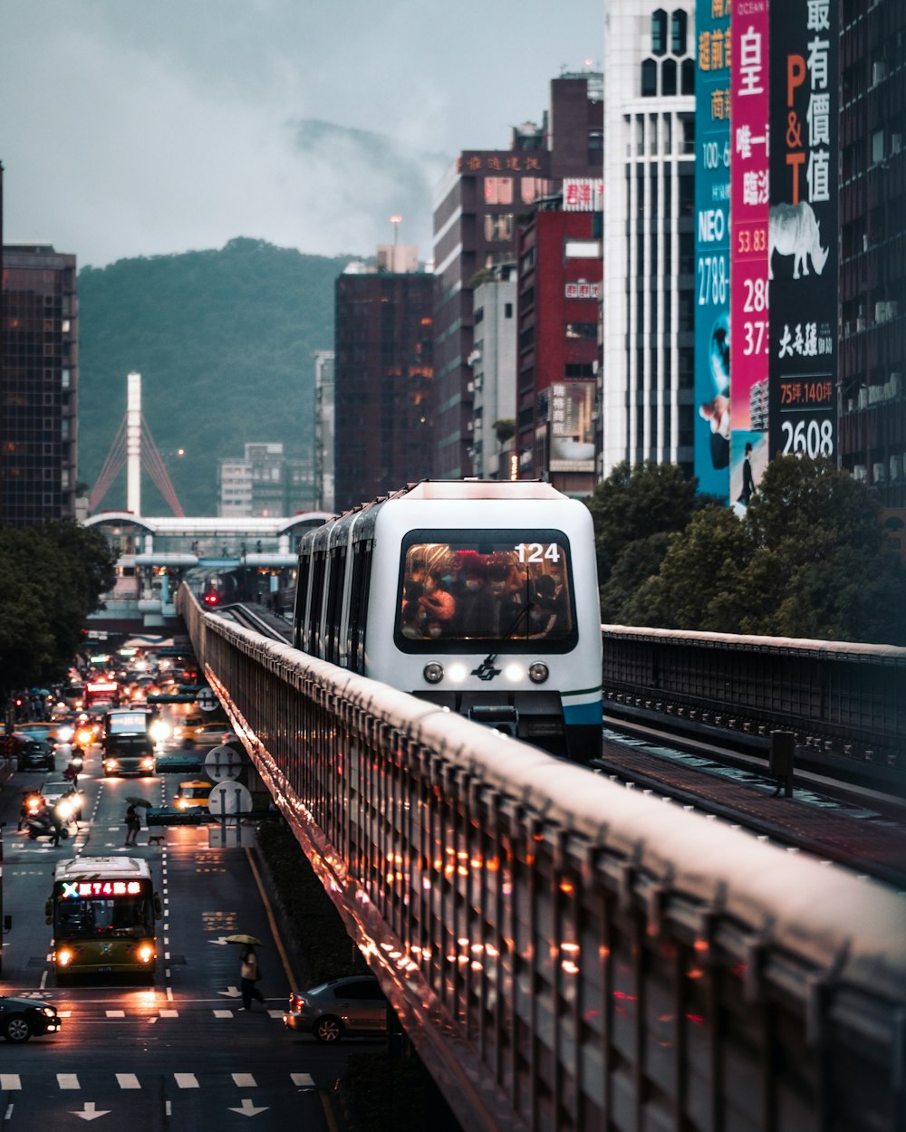 white and blue bus on road during daytime