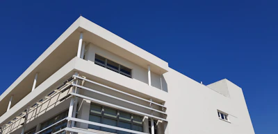 A sleek, white modern building showcasing clean lines and minimalist design.