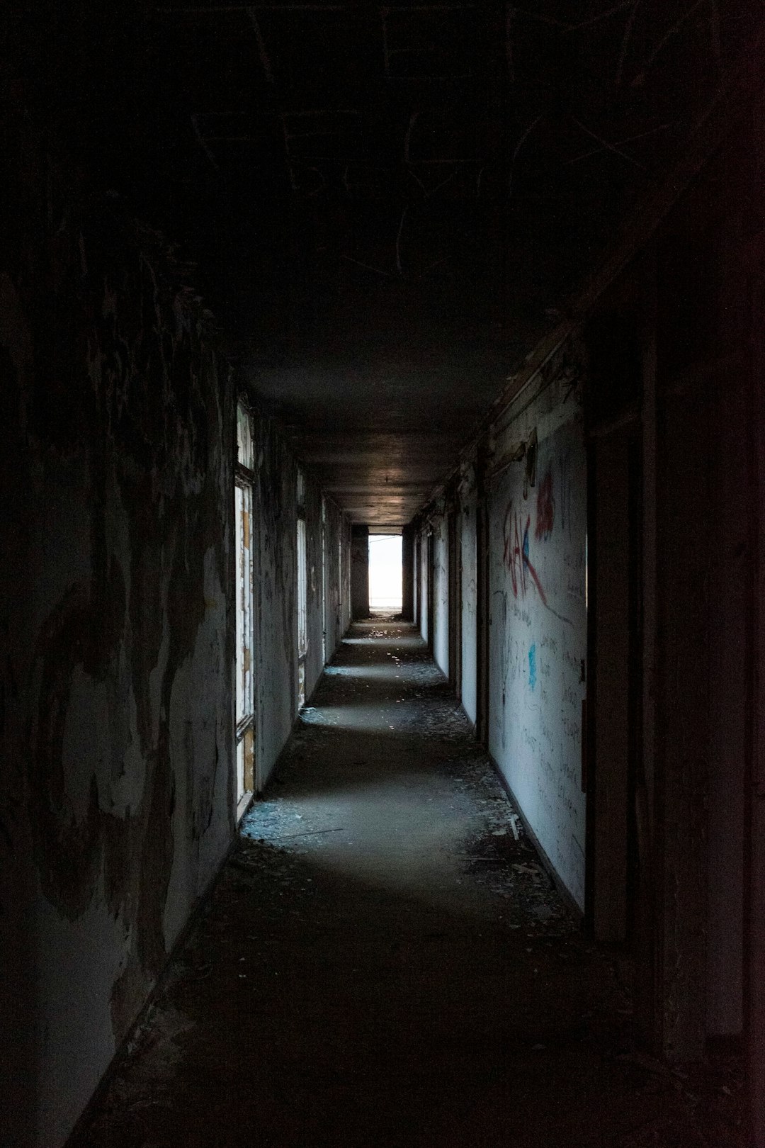 empty hallway with lights turned on during night time