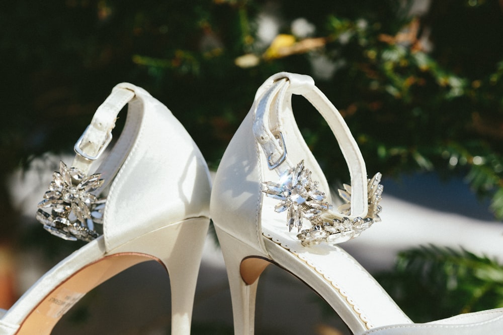 pair of white leather peep toe heeled sandals