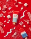 white and red heart shaped candy on red and white hearts print textile