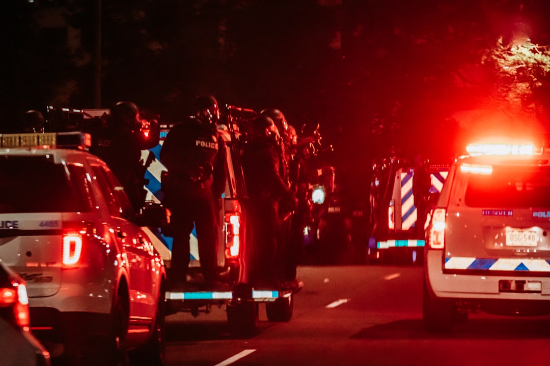 people riding on red motorcycle during nighttime