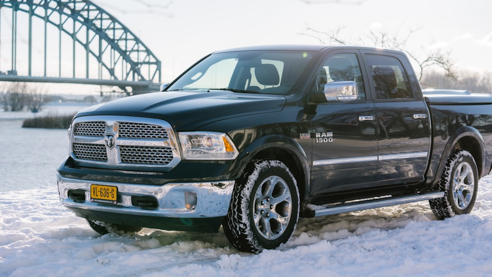 black chevrolet crew cab pickup truck on snow covered ground