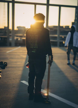 Close-up of Dash Caine 040 performing passionately on a gritty urban rooftop at sunset.