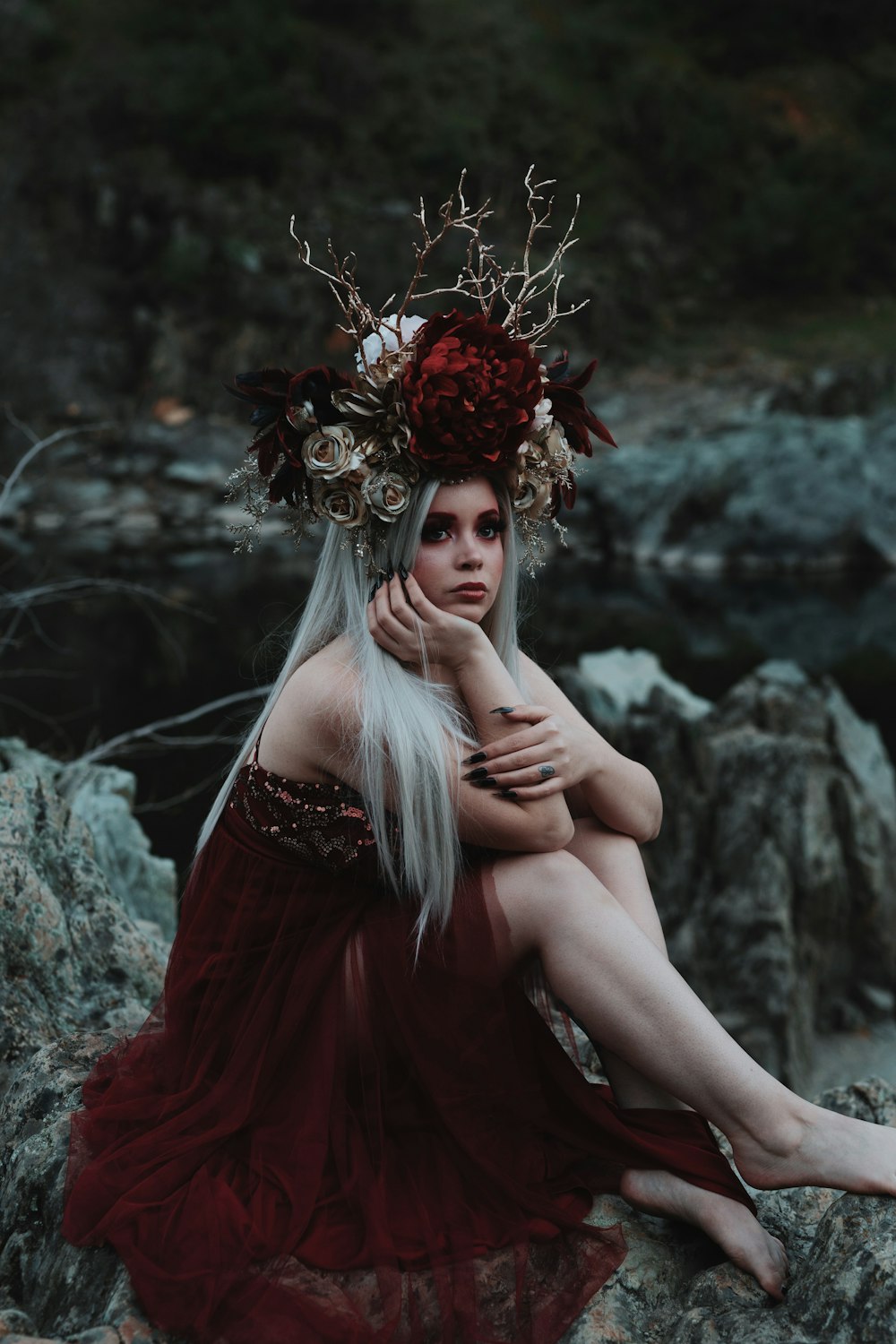 woman in red dress with red flowers on her head