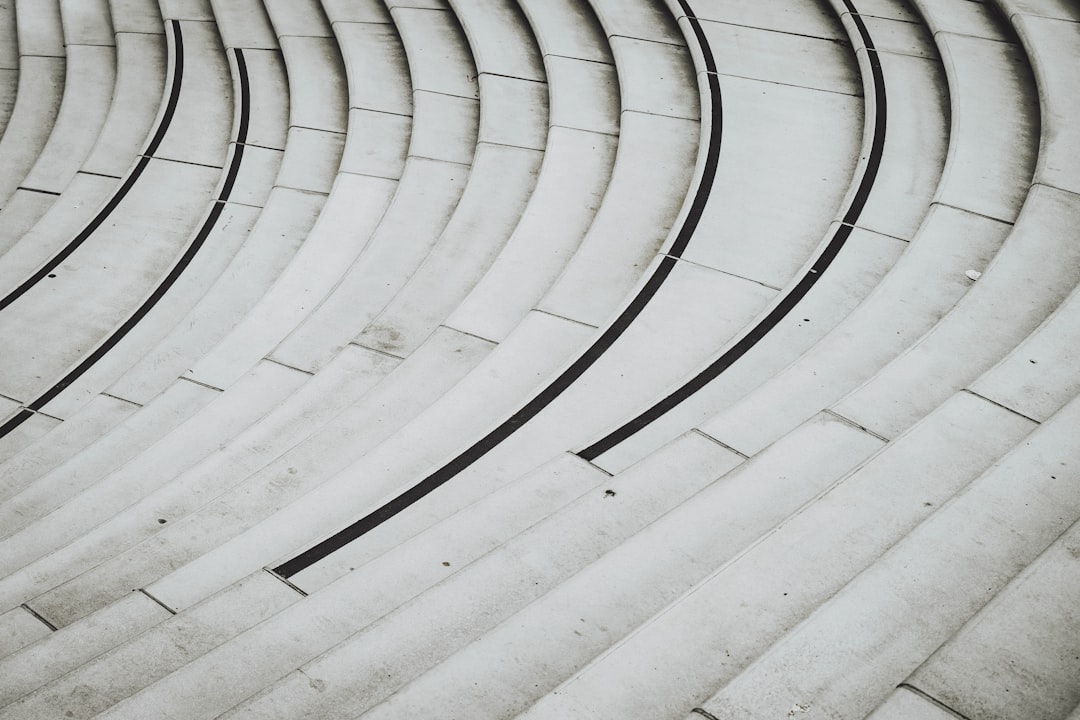 white concrete spiral stairs during daytime