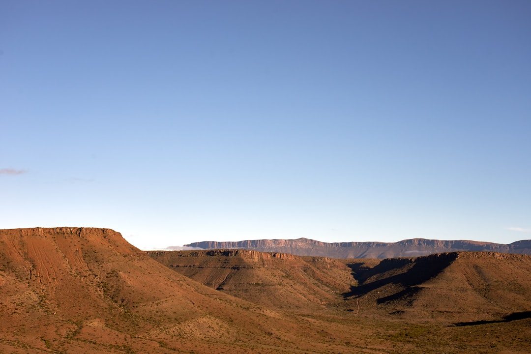 brown mountain under blue sky during daytime