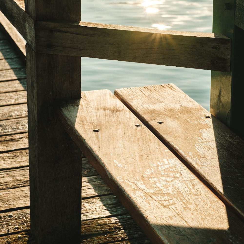 brown wooden dock over body of water during daytime