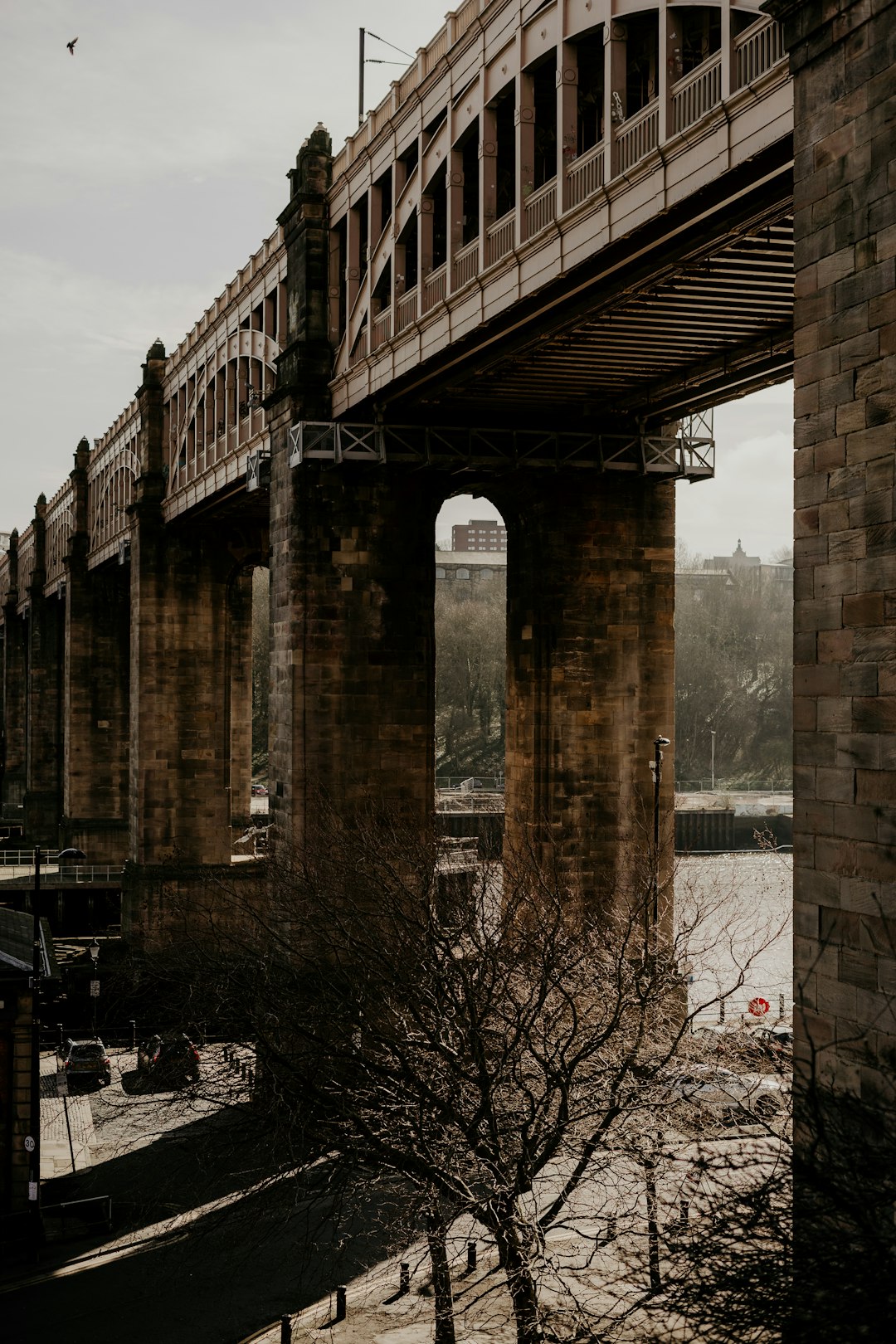 brown concrete bridge over river during daytime