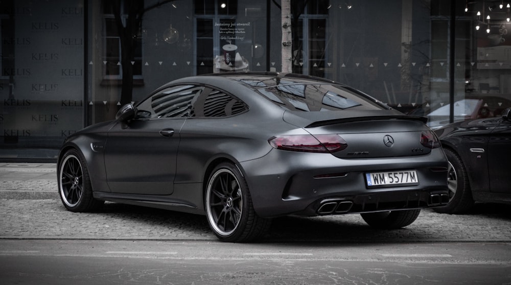 black bmw m 3 coupe parked on gray concrete road during daytime