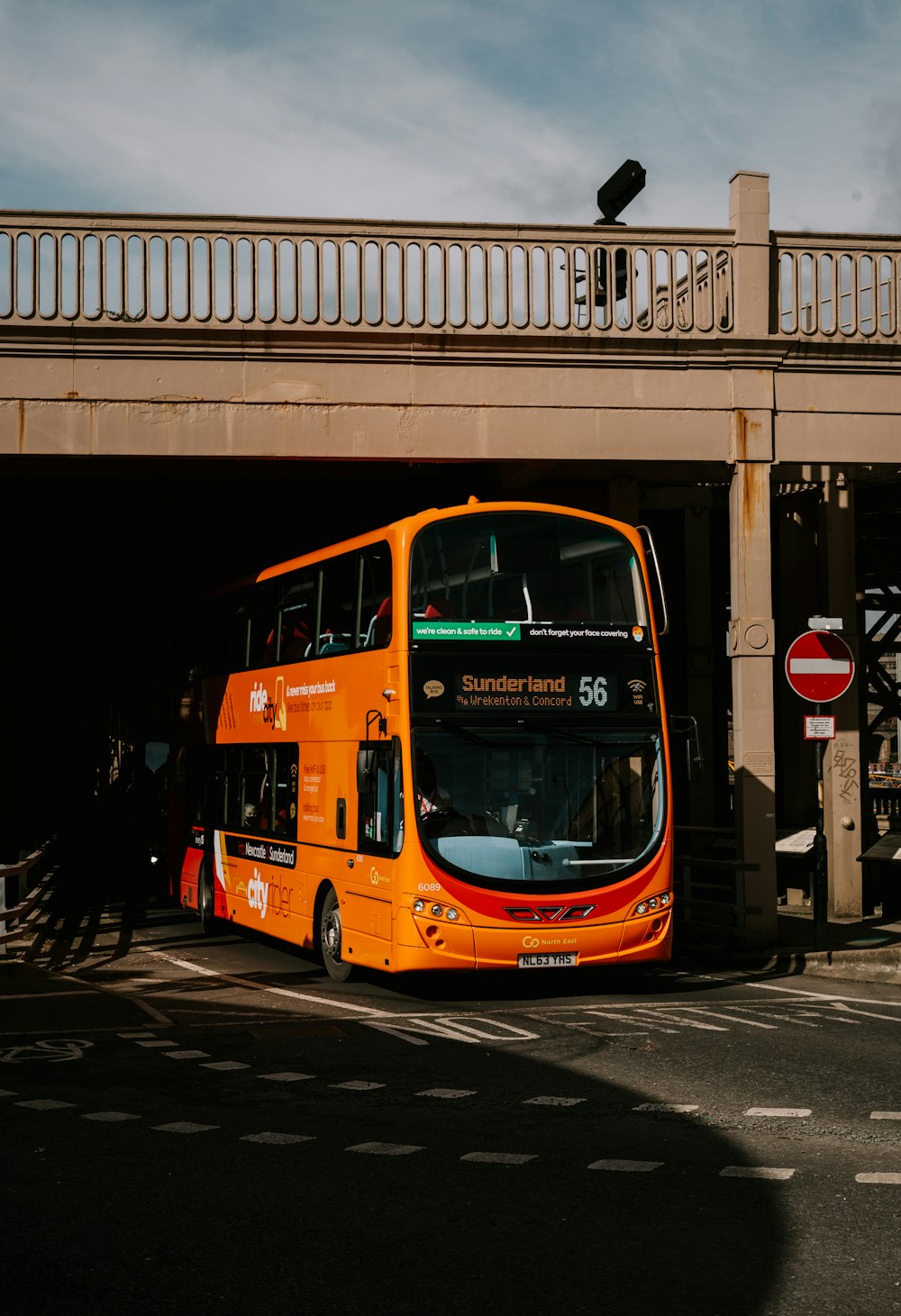 red double decker bus on road during night time