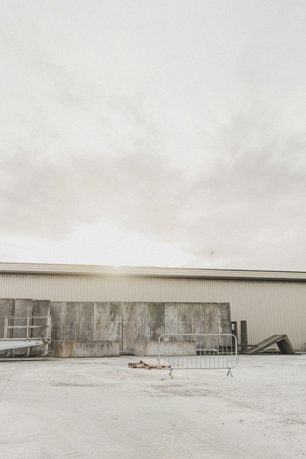 white concrete building under white sky during daytime