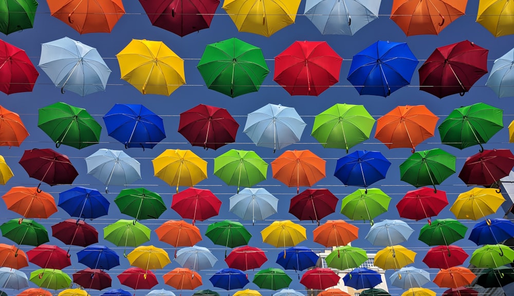 blue umbrella lot during daytime