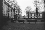 Monochrome image of an elegant urban park with clean pathways and minimalist benches.