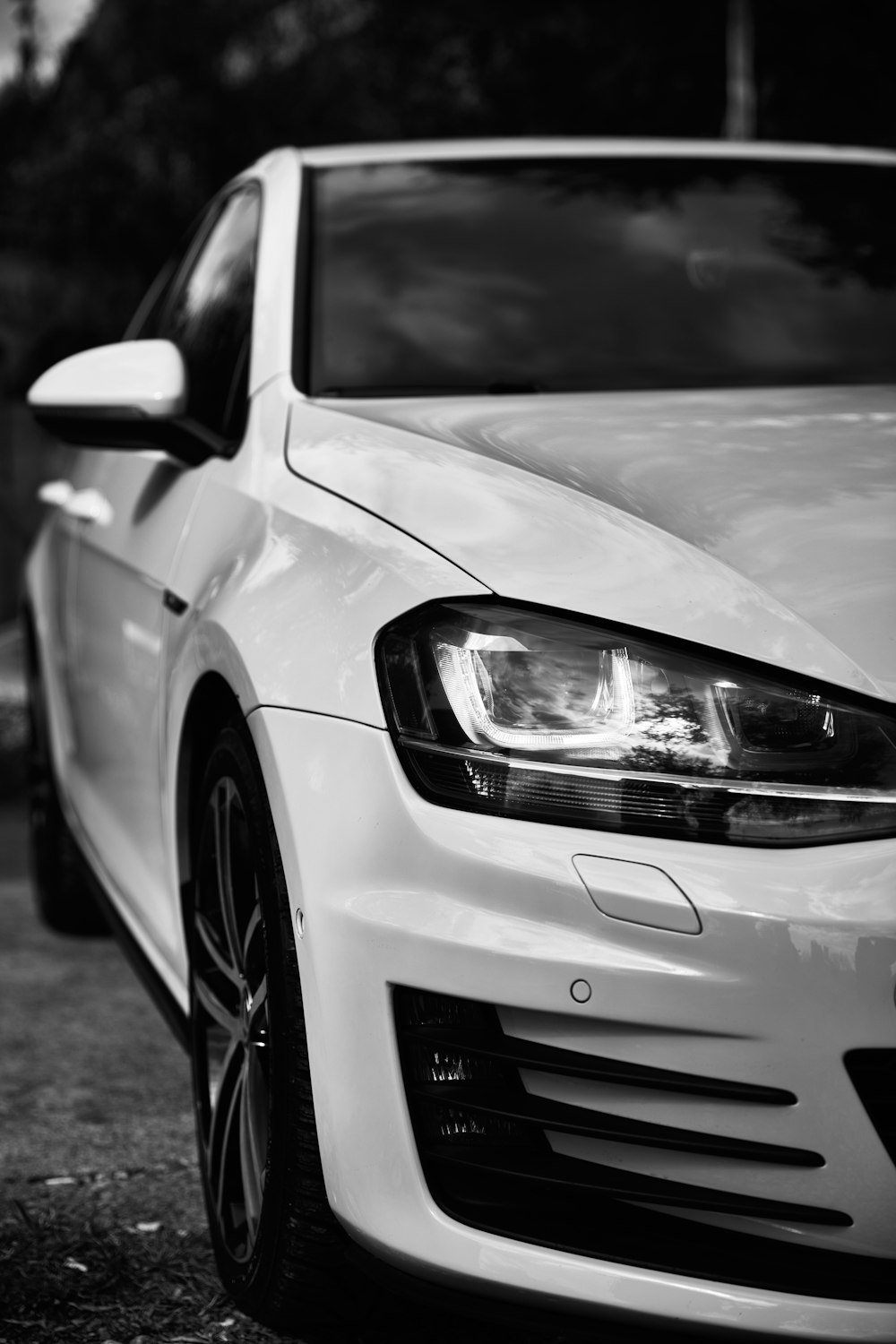 grayscale photo of car on road