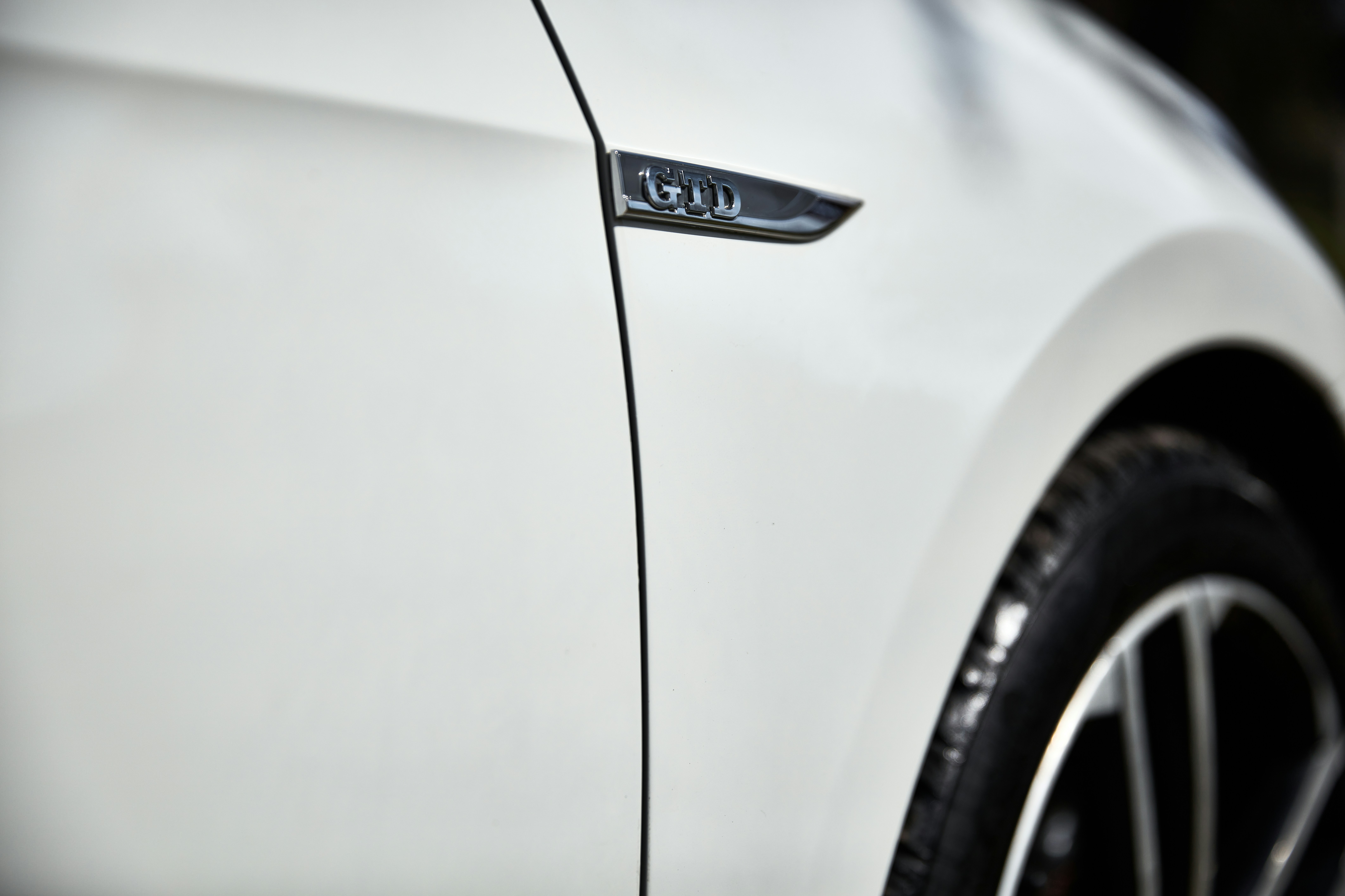white car with black wheel