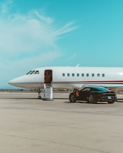 white and red passenger plane on airport during daytime