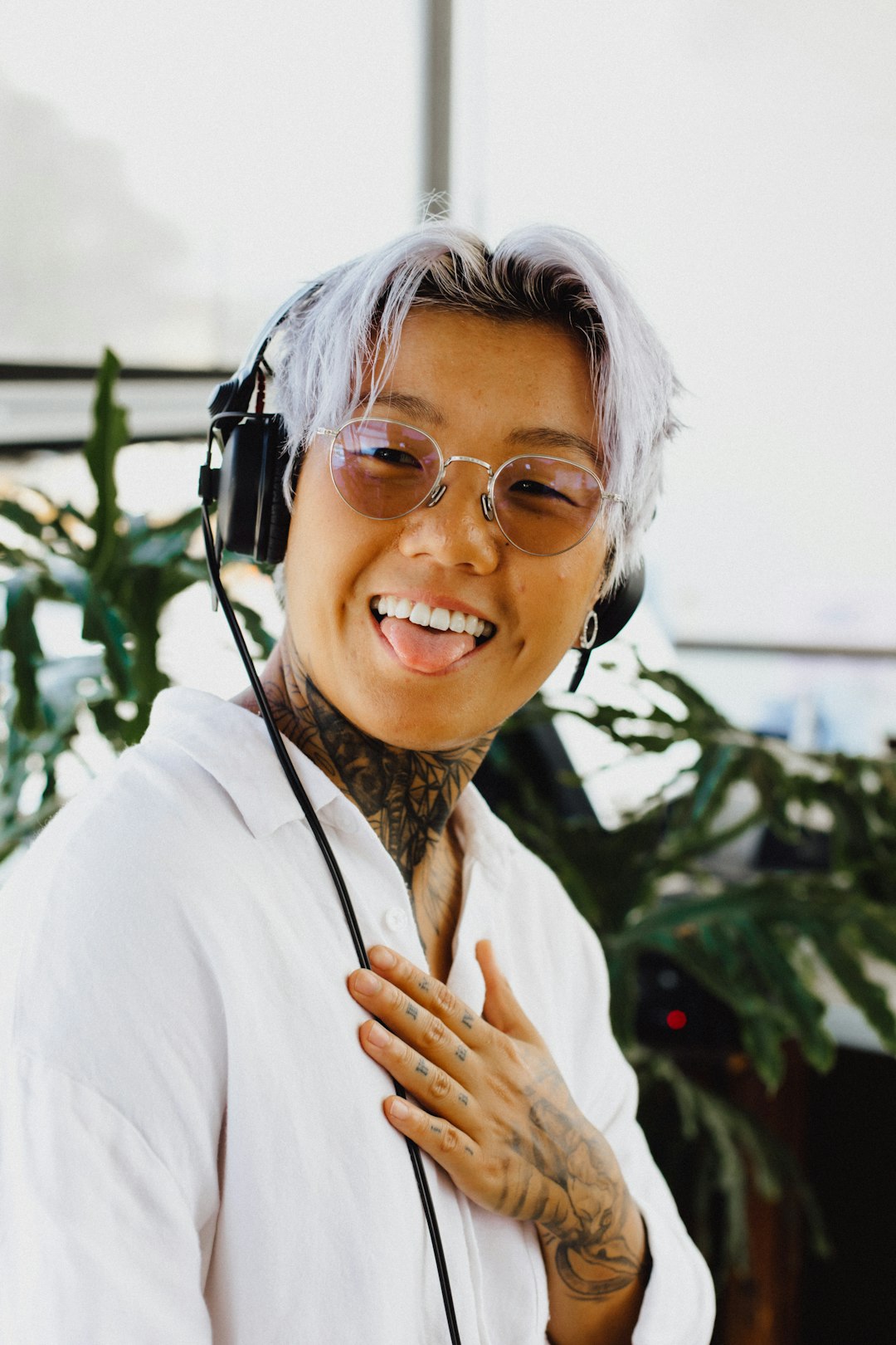 woman in white long sleeve shirt wearing black sunglasses