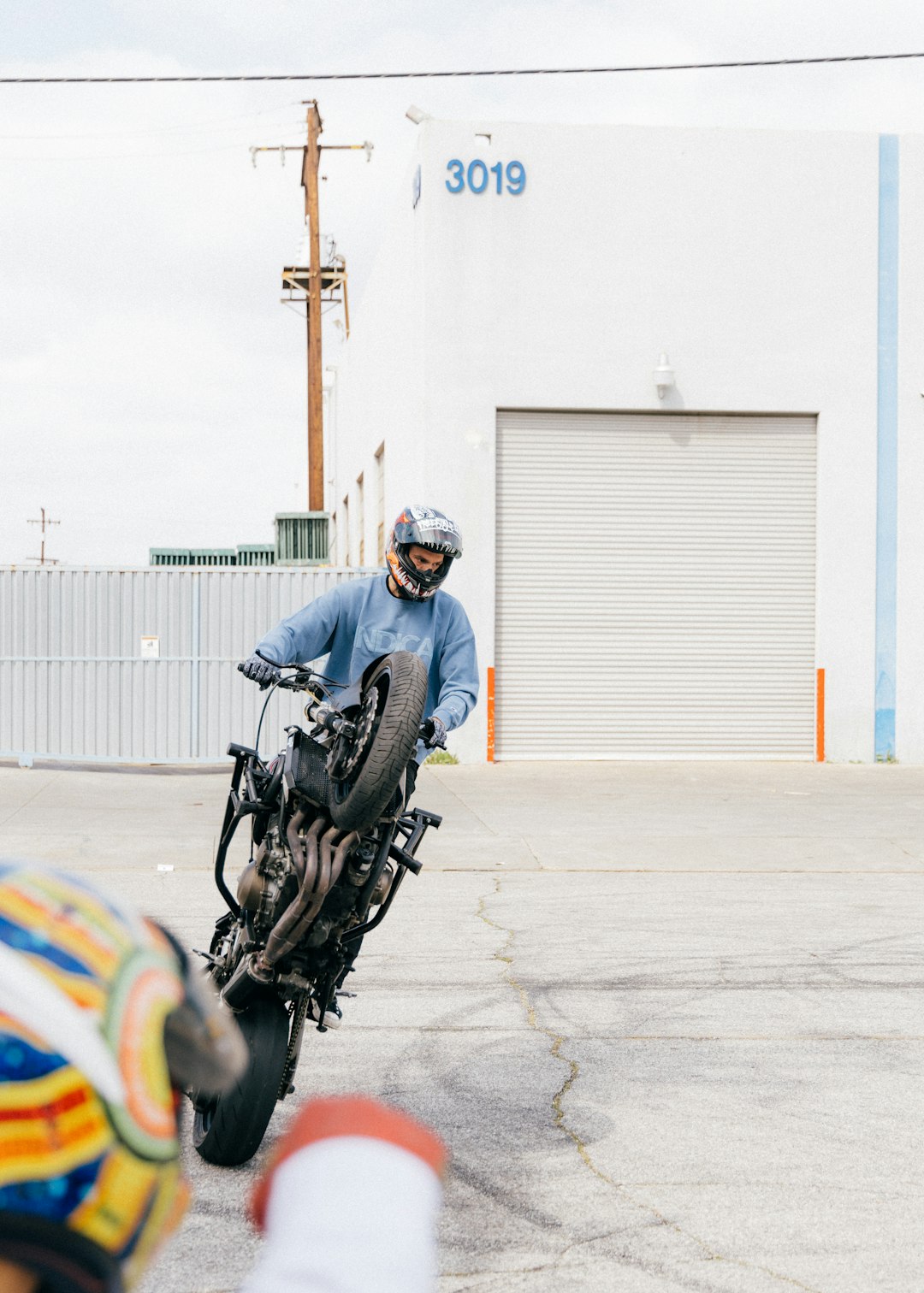 man in blue jacket riding motorcycle during daytime