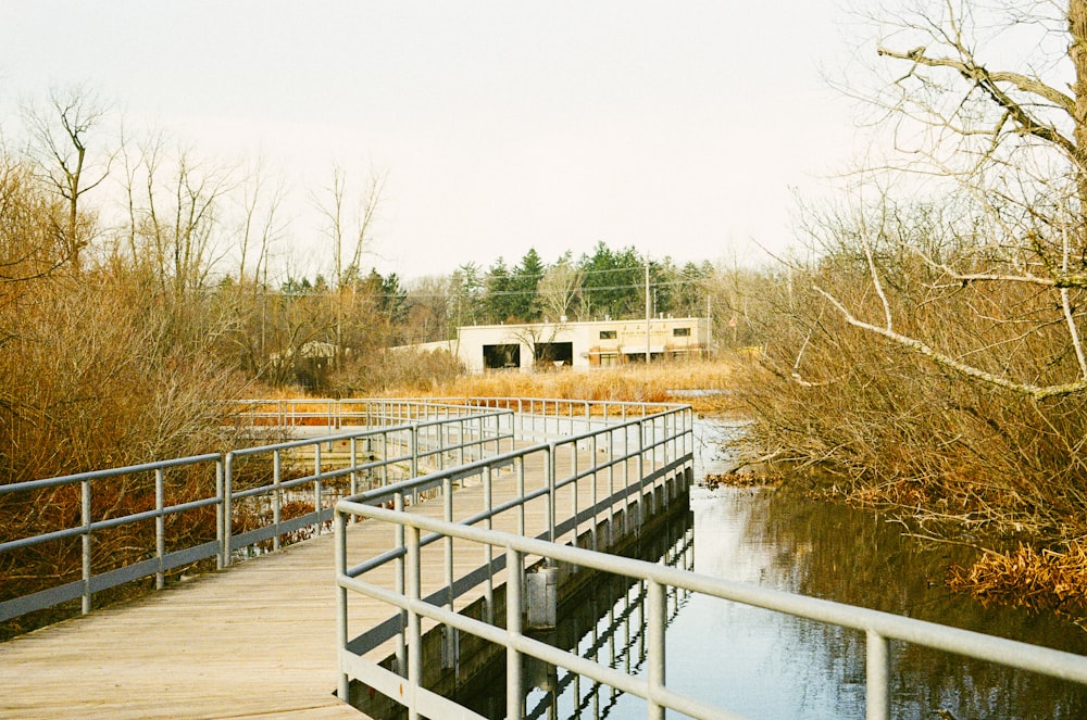 white wooden bridge over river