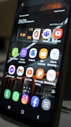 A close-up of a smartphone displaying monitoring software.