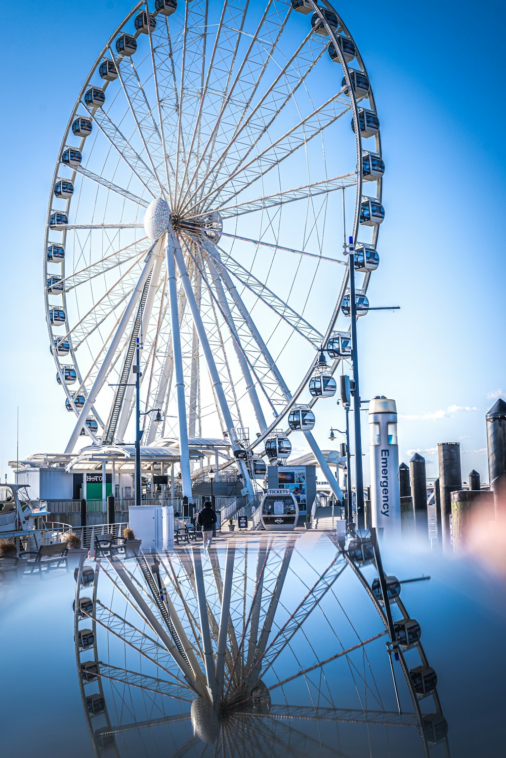 ferris wheel near city buildings during night time