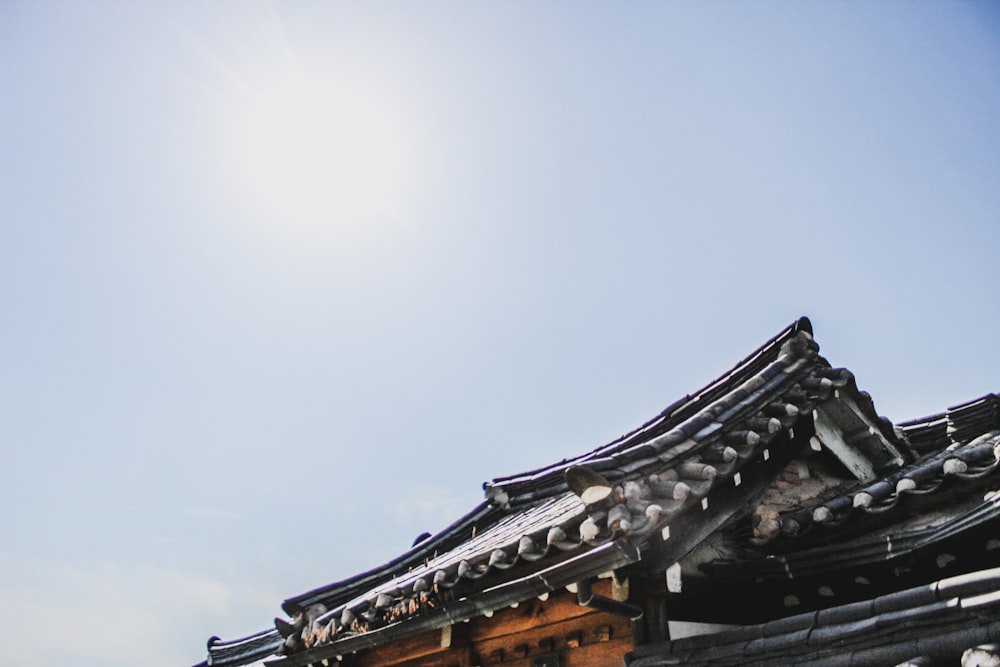 brown wooden roof under blue sky during daytime