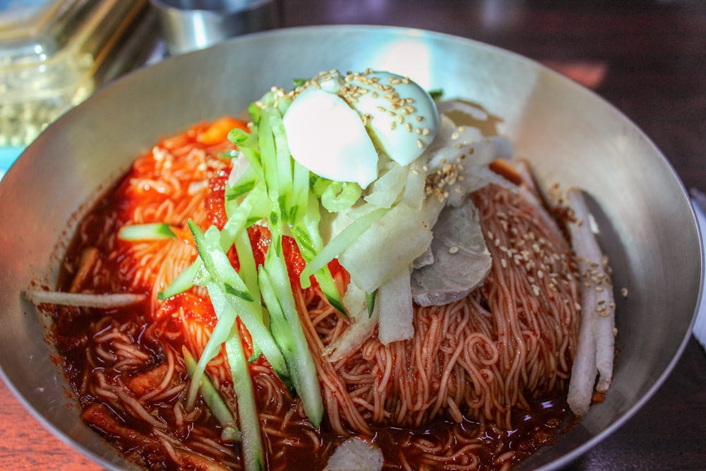 cooked food on stainless steel bowl