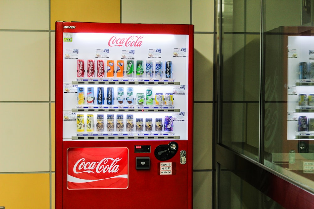 red and white coca cola vending machine