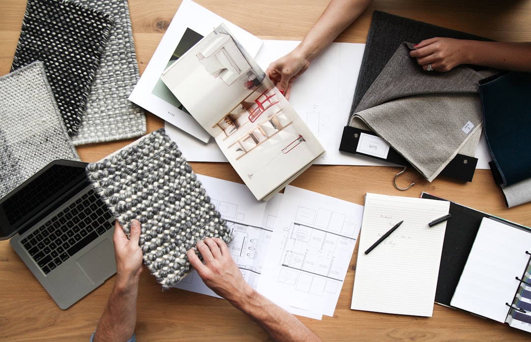 person holding white printer paper