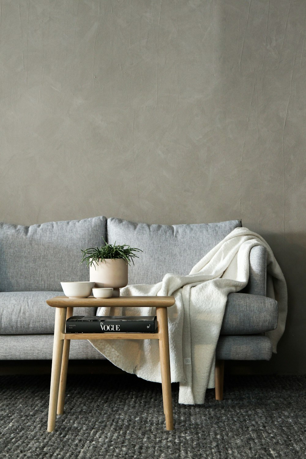 gray sofa with white towel