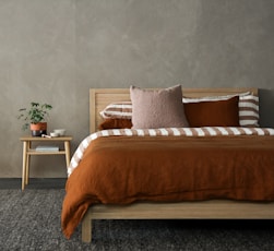 brown and white bed linen