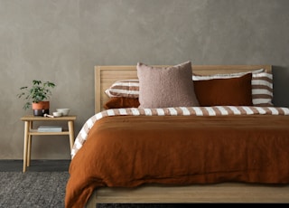 brown and white bed linen