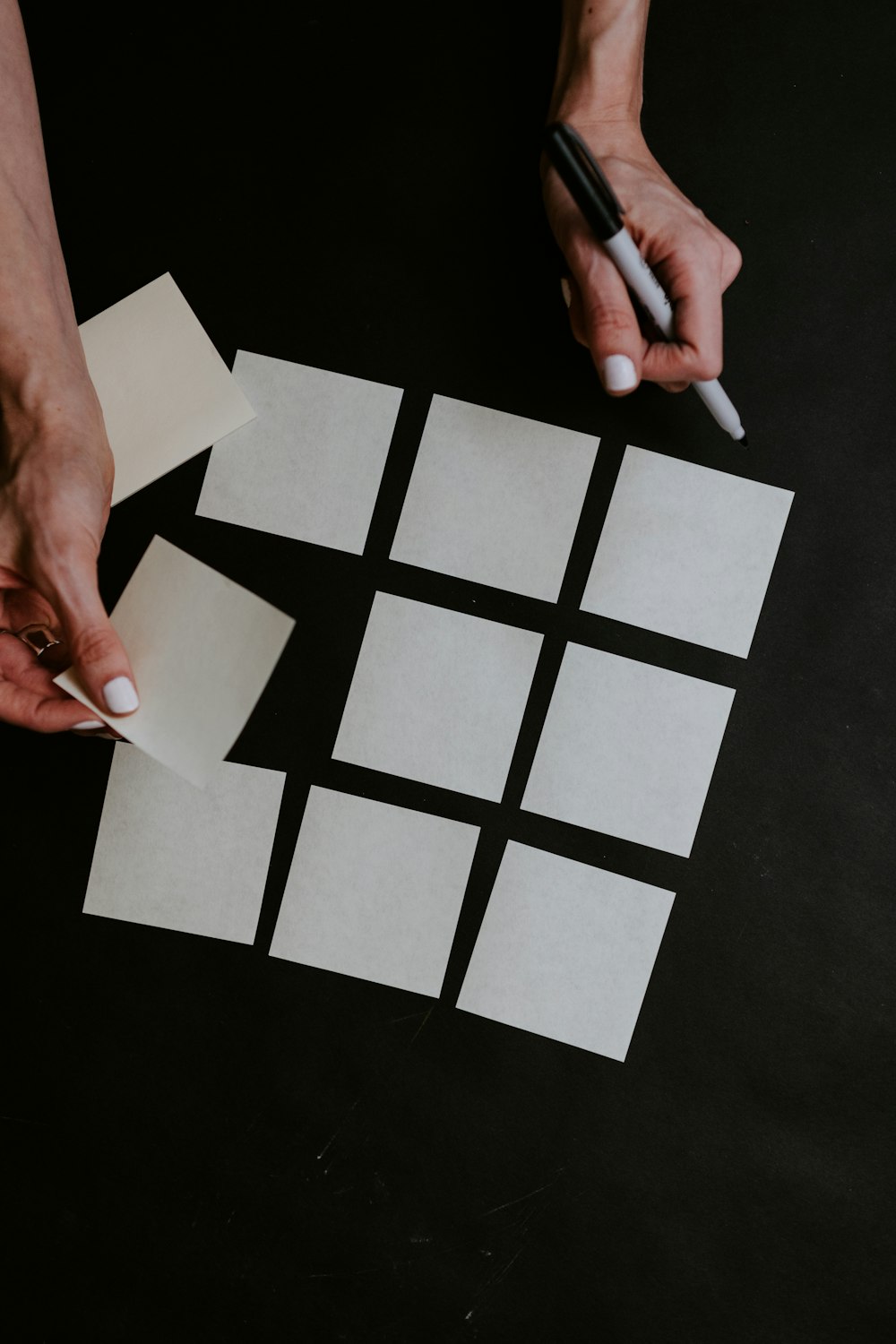 person holding white printer paper