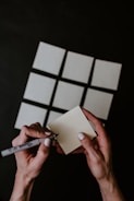person holding white printer paper