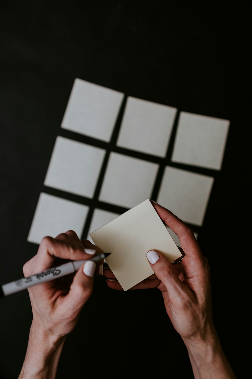 person holding white printer paper