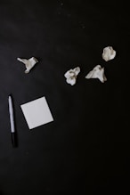 white paper on black table