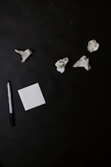 A frustrated individual surrounded by unfinished tasks and notes.