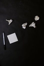white paper on black table