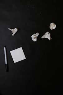 white paper on black table
