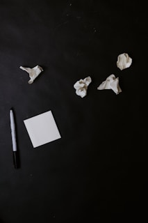 white paper on black table