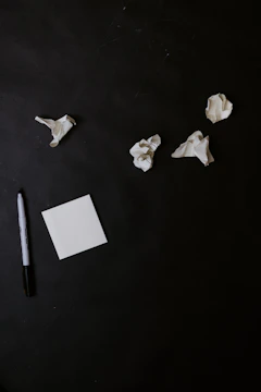 A frustrated individual surrounded by unfinished tasks and notes.