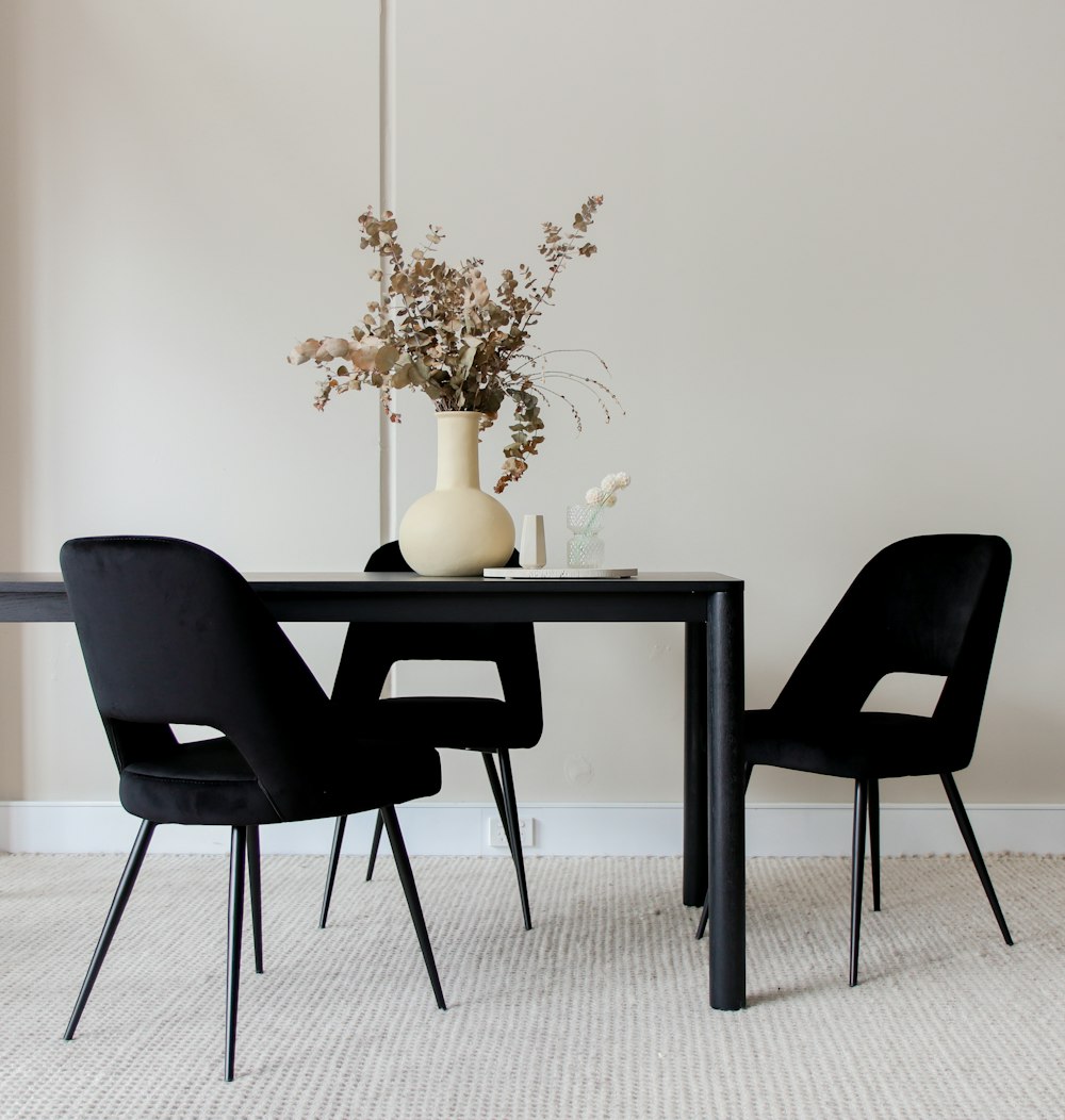 black leather padded chair beside white table