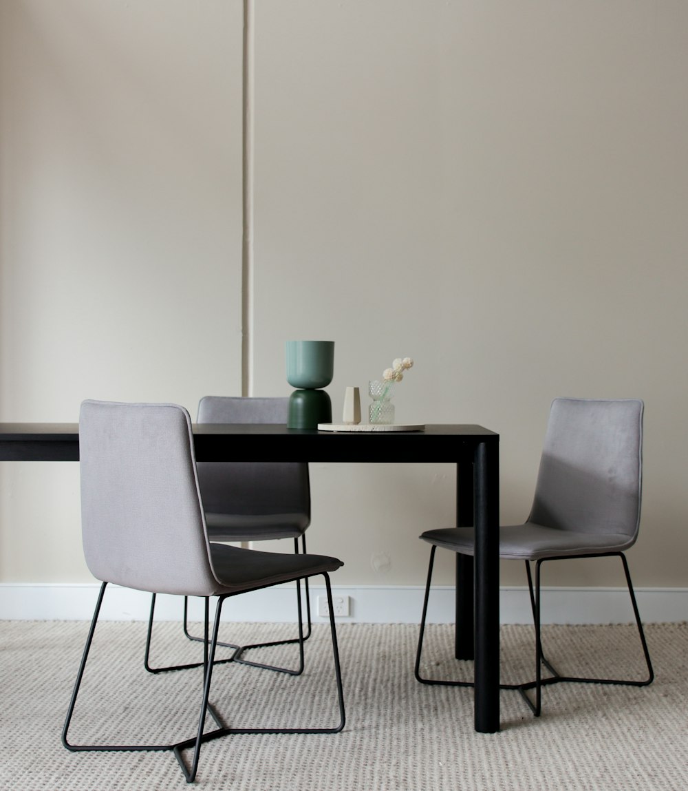 black and white wooden table with chairs