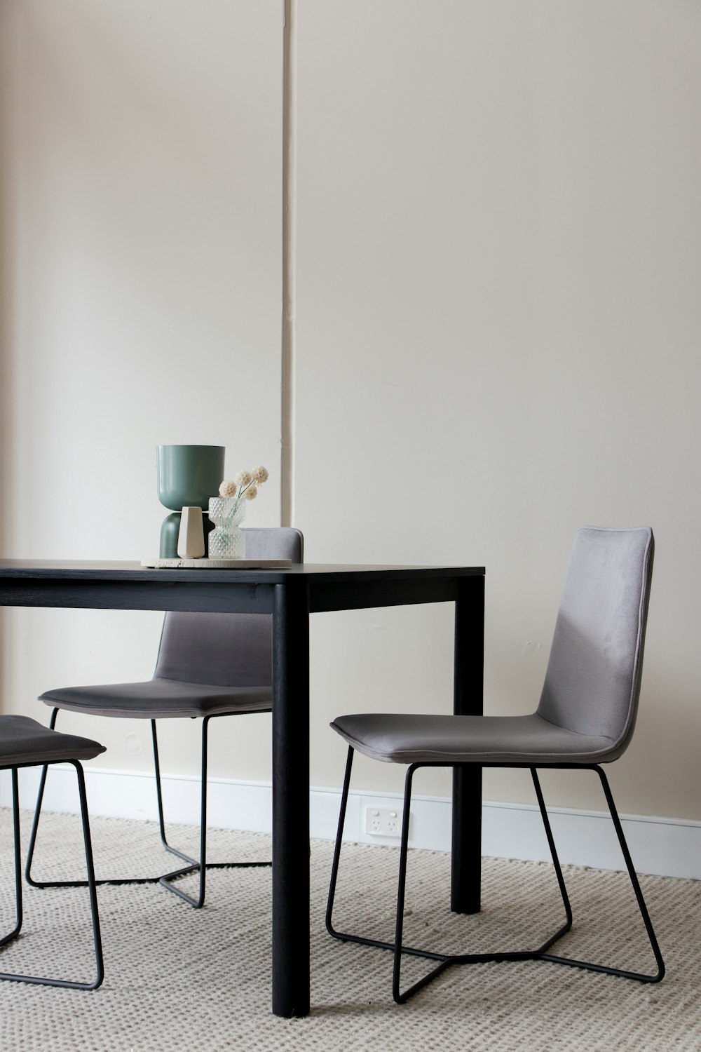 black wooden table with chairs