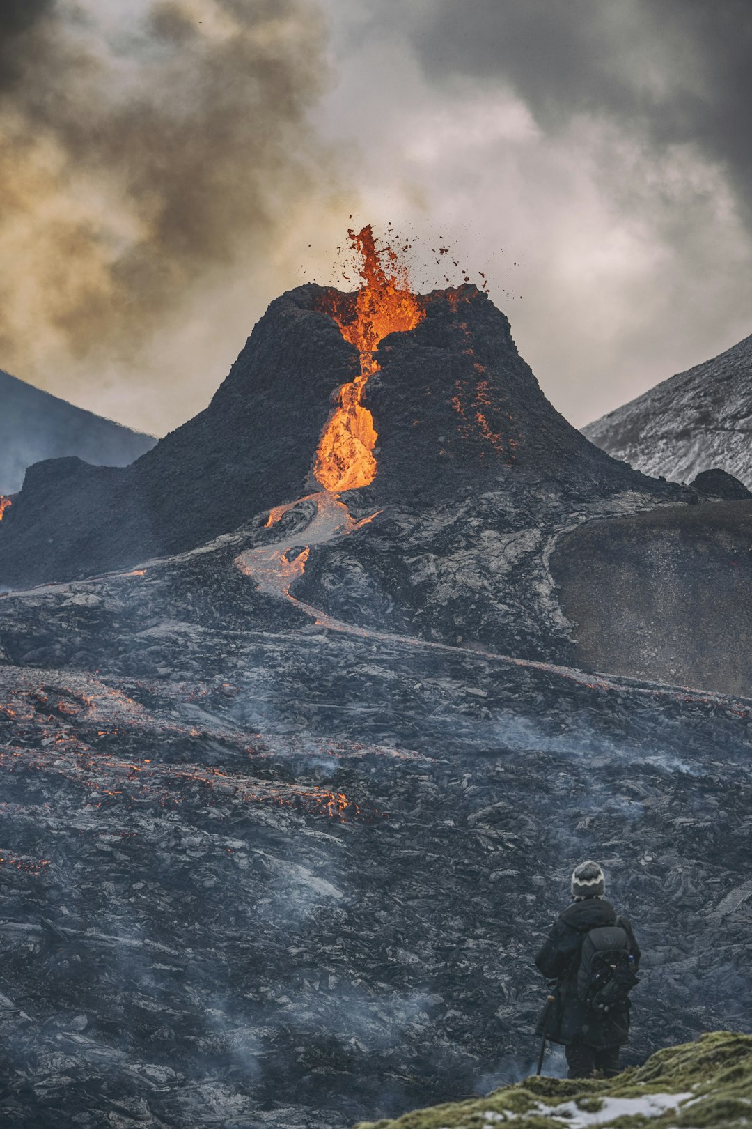 fire coming from mountain during daytime