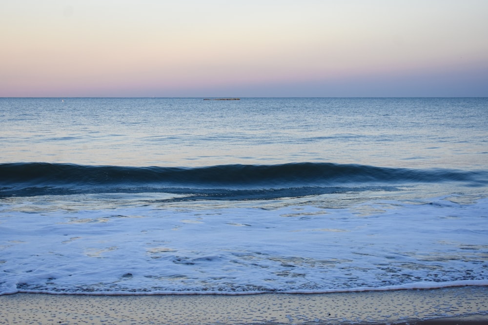 blue ocean water under blue sky during daytime