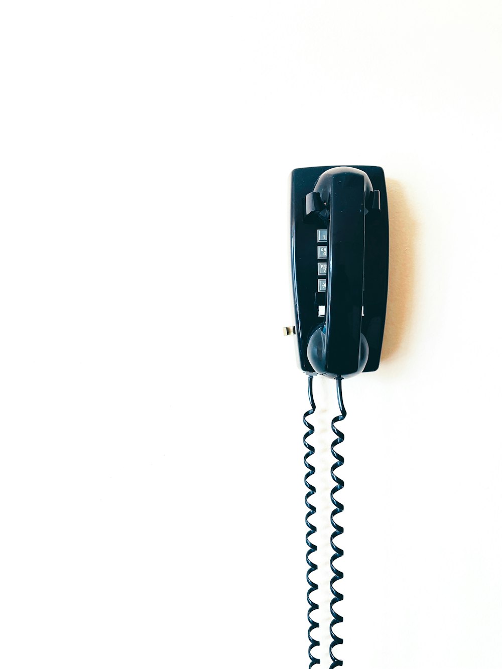 black telephone on white surface