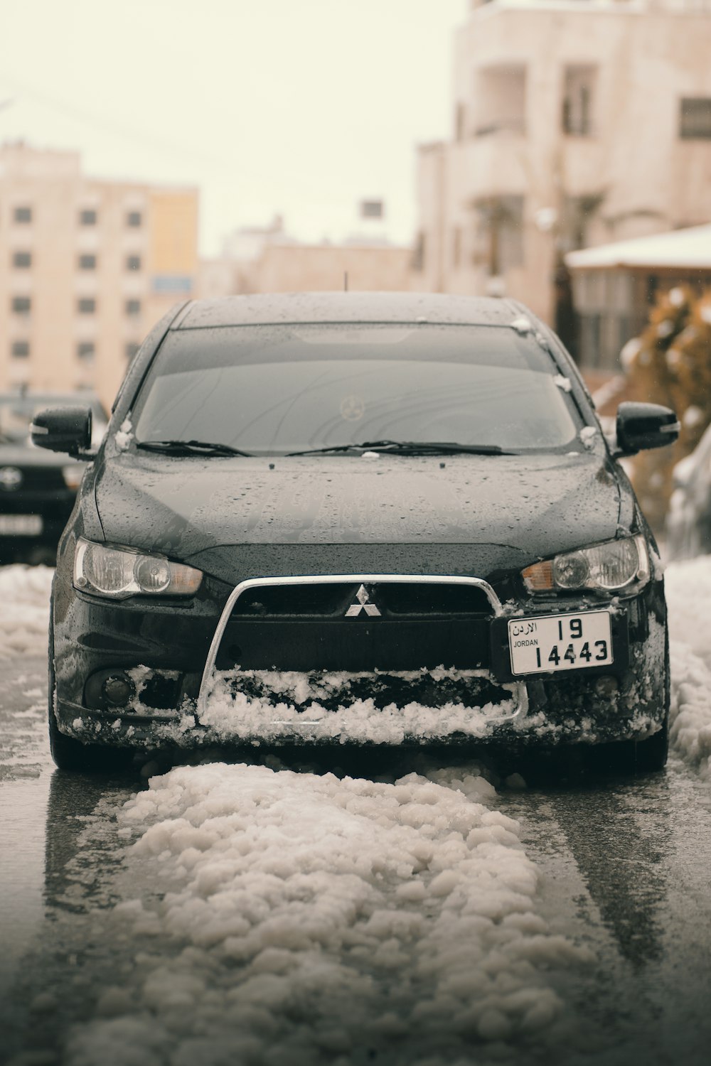 black honda car on snow covered road during daytime